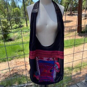 Navy handbag with bird embroidery and pompoms!